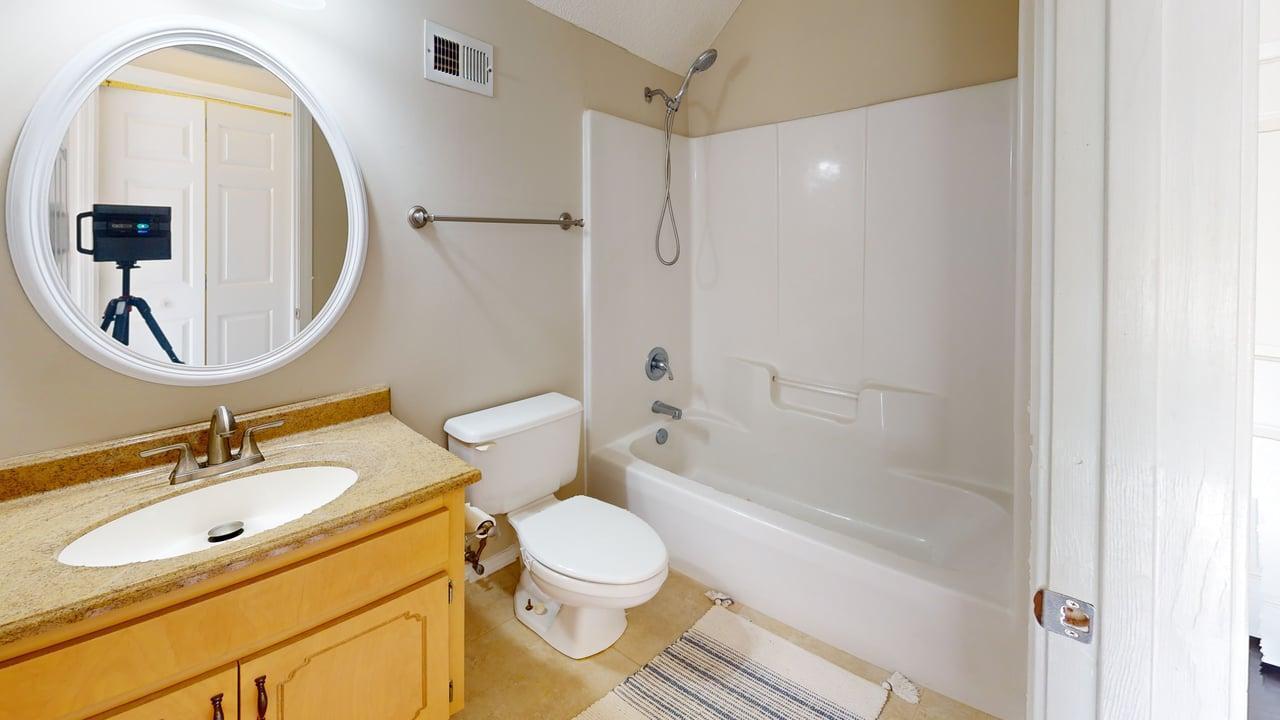 855 Mande Court Shalimar, FL 32579 - Photo 46 of 65 a bathroom with a sink and a mirror