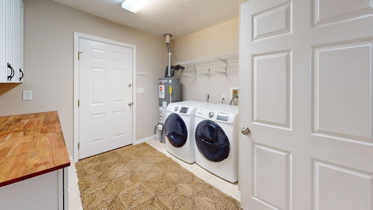 855 Mande Court Shalimar, FL 32579 - Photo 61 of 65 a utility room with dryer and washer