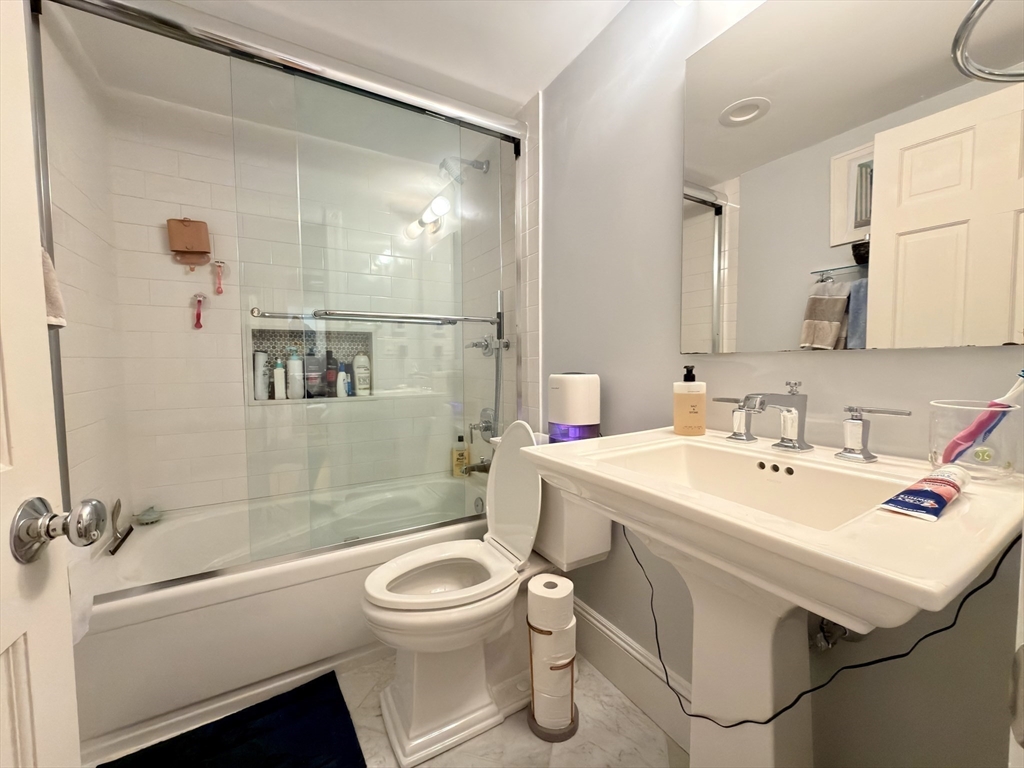 41 Pinckney Street, Unit B Boston, MA 02114 - Photo 14 of 31 a bathroom with a sink toilet and shower