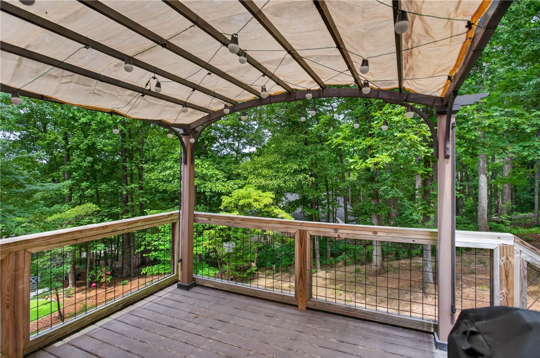 136 Loran Pointe Circle Seneca, SC 29672 - Photo 43 of 50 A private deck overlooking a lush green landscape, perfect for serene outdoor living.
