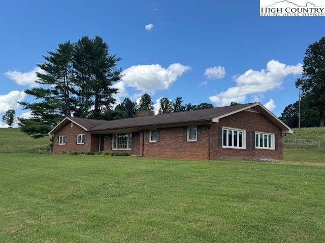427 J E Gentry Road Crumpler, NC 28617 - Photo 2 of 30 a front view of a house with garden