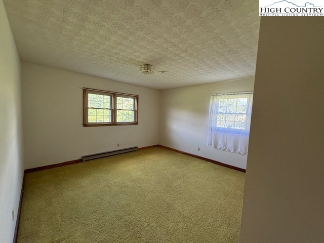 427 J E Gentry Road Crumpler, NC 28617 - Photo 21 of 30 a view of an empty room with a window