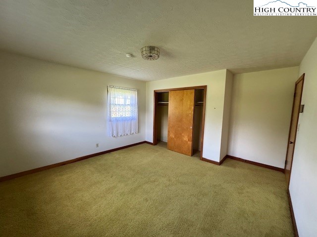 427 J E Gentry Road Crumpler, NC 28617 - Photo 22 of 30 an empty room with windows