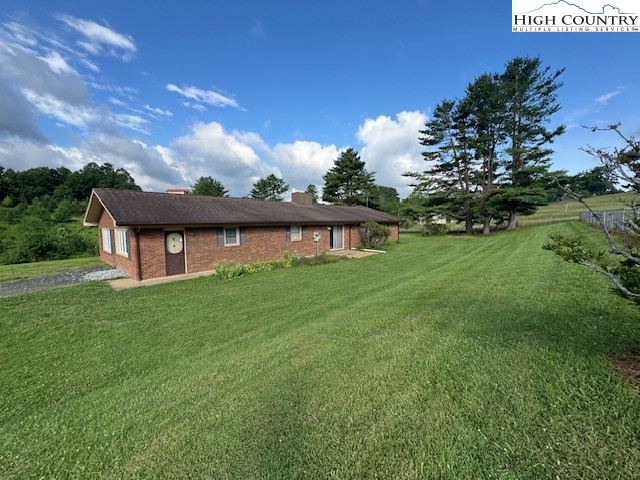 427 J E Gentry Road Crumpler, NC 28617 - Photo 3 of 30 a view of a house with a backyard