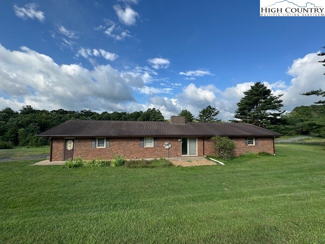 427 J E Gentry Road Crumpler, NC 28617 - Photo 4 of 30 a view of a house with a backyard