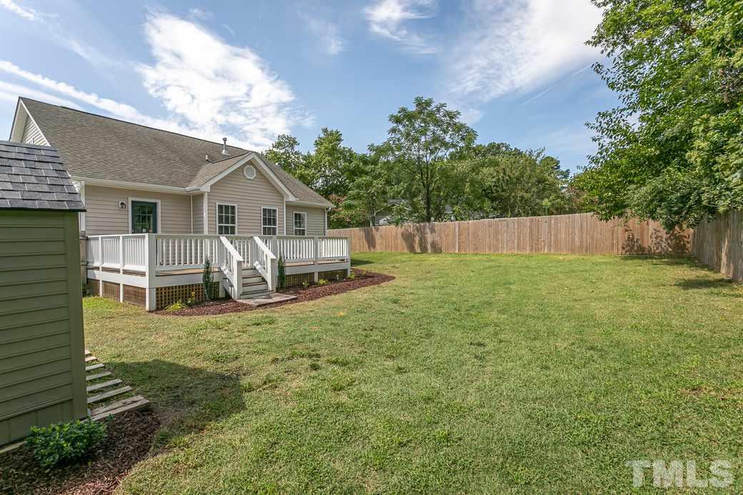 605 Brighton Road Raleigh, NC 27610 - Photo 9 of 10 The gorgeous landscaping extends to the large flat back yard. The FENCE and tree lined back give plenty of privacy. There are two storage sheds and a lot of room for your pets, family and friends to enjoy the outdoors.