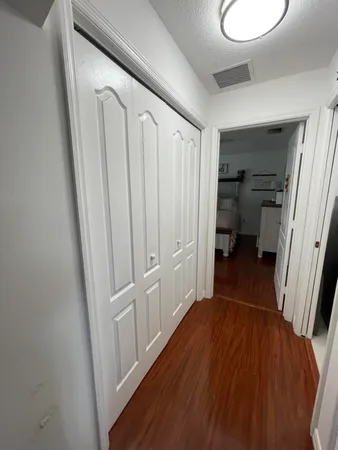 a bedroom with bed and a window