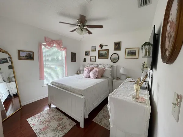 a bed room with a bed and a clock