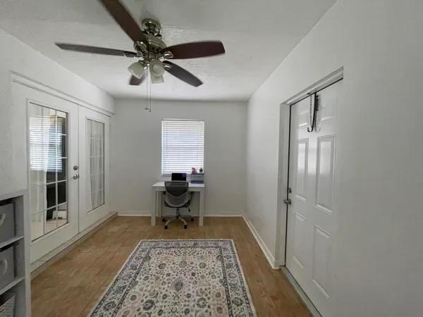 a living room with furniture and a rug