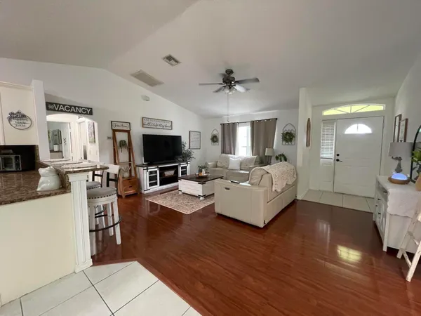 a living room with furniture and a flat screen tv