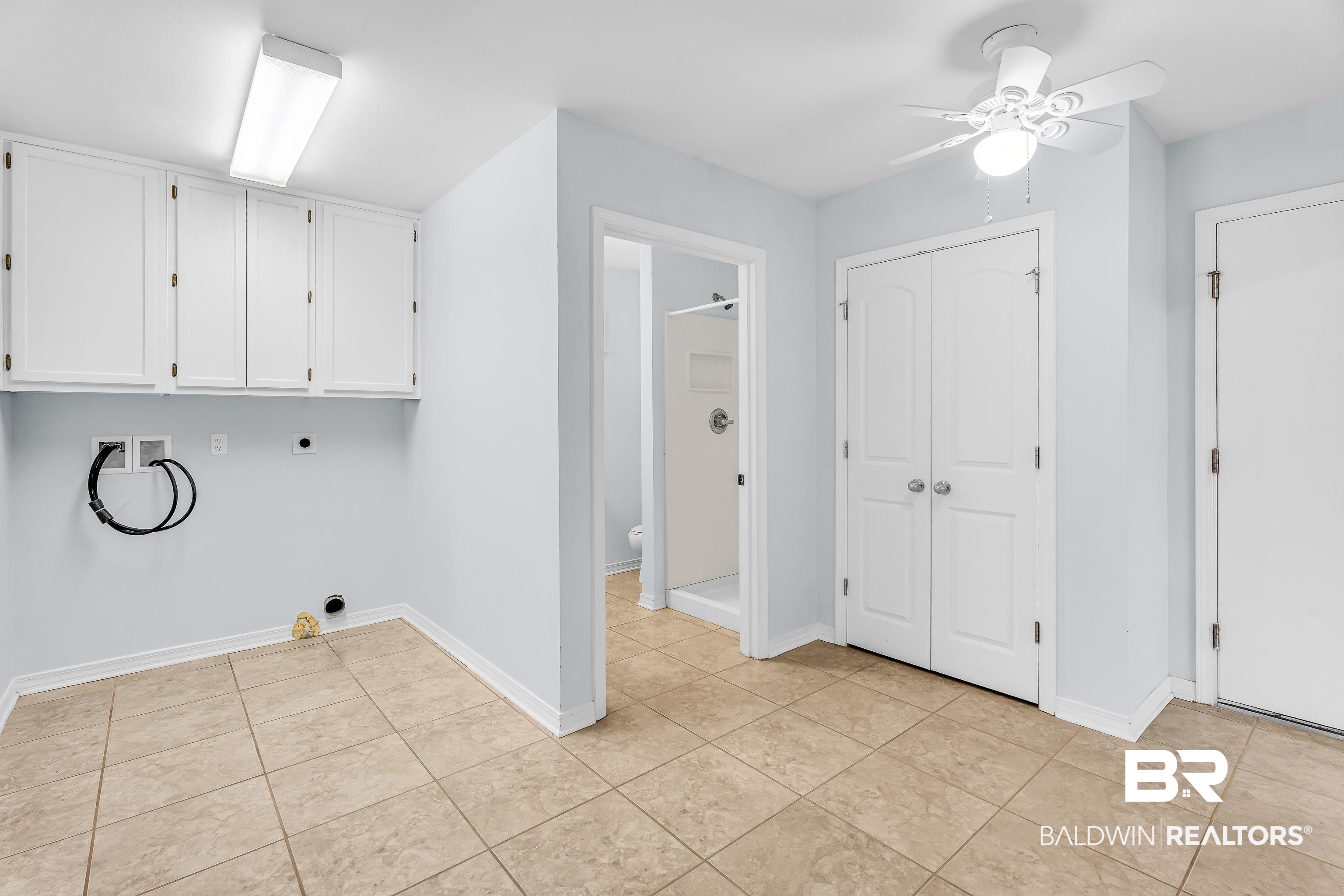 22095 8th Street Silverhill, AL 36576 - Photo 26 of 42 Laundry area with cabinets. Located within a room that leads to flex space/office and 3rd bathroom. That rooms leads to garage.