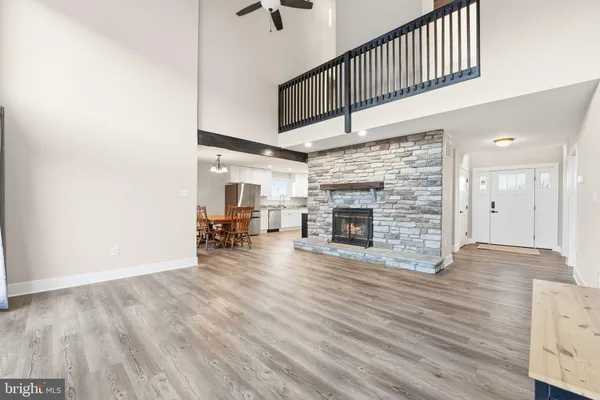 a kitchen with stainless steel appliances granite countertop a stove a refrigerator and a microwave