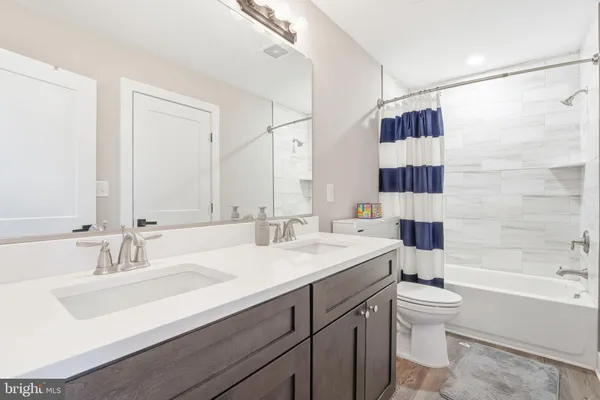 a view of a kitchen with dining table and chairs