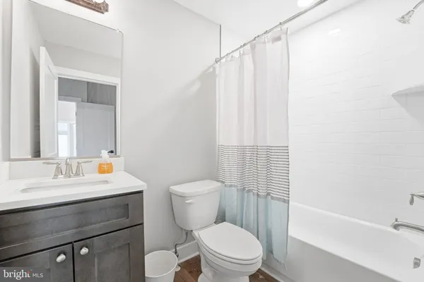 a view of a house with a backyard and chairs