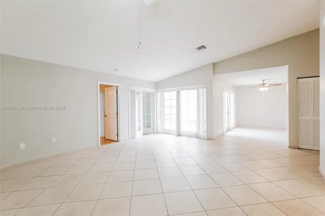 a view of an empty room with a window