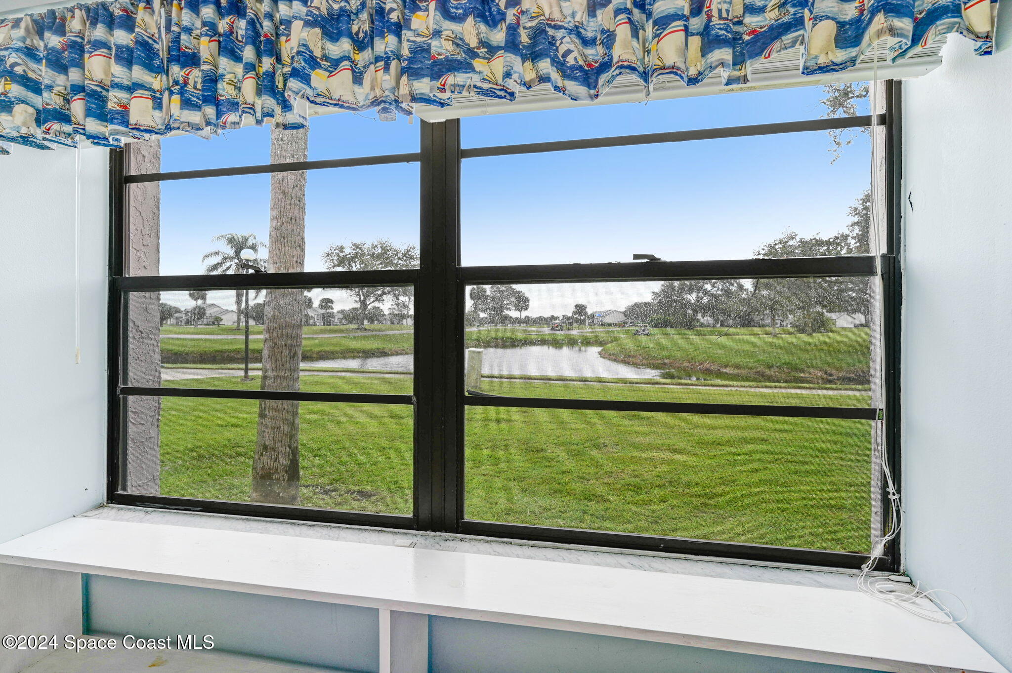 2727 North Wickham Road, Unit 1068 Melbourne, FL 32935 - Photo 13 of 30 Rear View