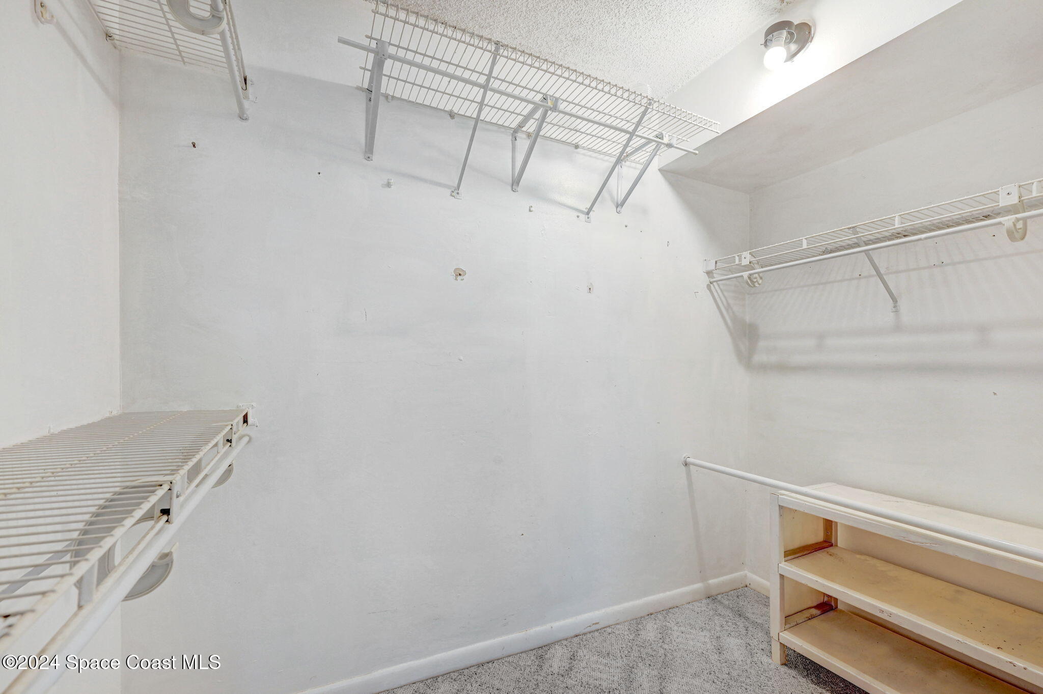 2727 North Wickham Road, Unit 1068 Melbourne, FL 32935 - Photo 19 of 30 Front Bedroom Walk-In closet