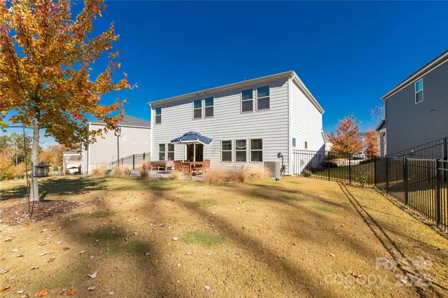 a view of a house with snow on the road