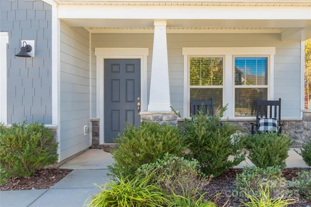 a front view of a house with a porch