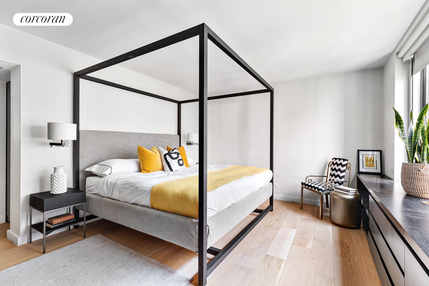 110 East 71st Street, Unit 4 Manhattan, NY 10021 - Photo 11 of 22 a bedroom with a bed and a flat tv screen on dresser