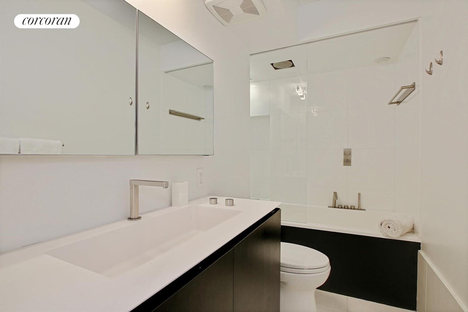 110 East 71st Street, Unit 4 Manhattan, NY 10021 - Photo 12 of 22 a bathroom with a sink and a toilet