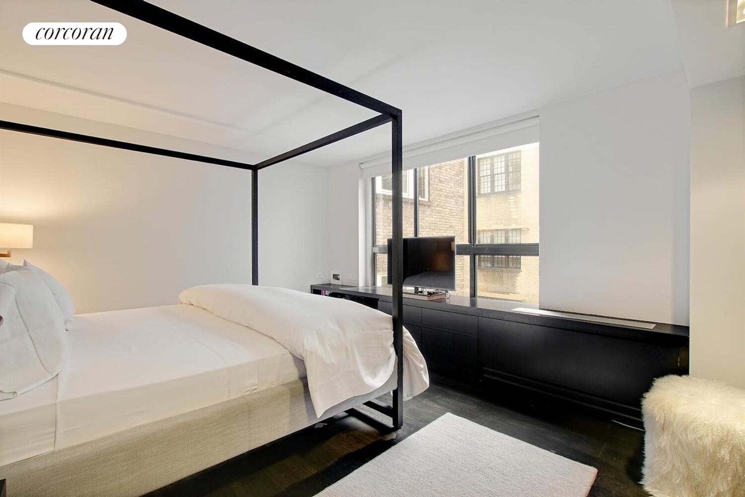 110 East 71st Street, Unit 4 Manhattan, NY 10021 - Photo 13 of 22 a bedroom with a bed and a window