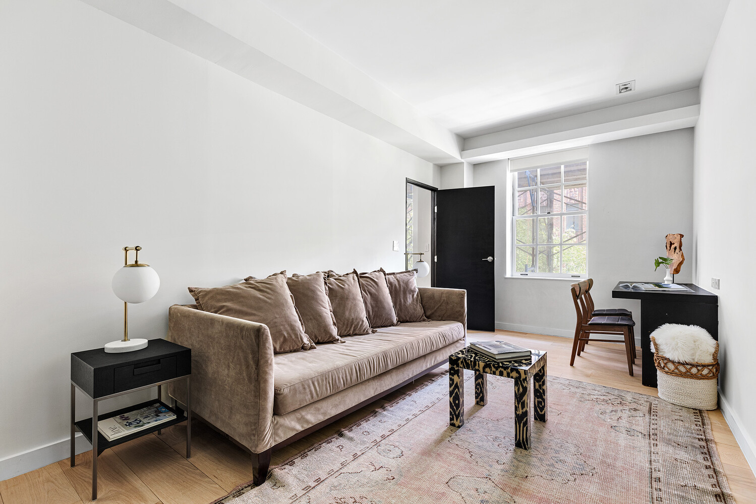 110 East 71st Street, Unit 4 Manhattan, NY 10021 - Photo 18 of 22 a living room with furniture a lamp and a window