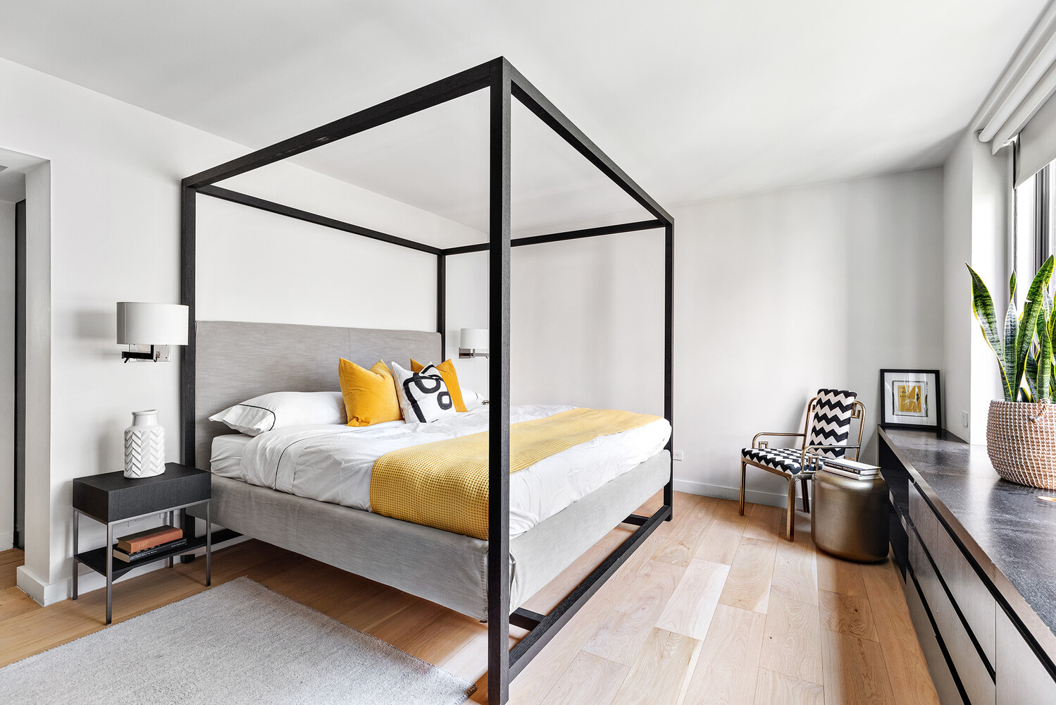 110 East 71st Street, Unit 4 Manhattan, NY 10021 - Photo 19 of 22 a bedroom with a bed and a flat tv screen on dresser