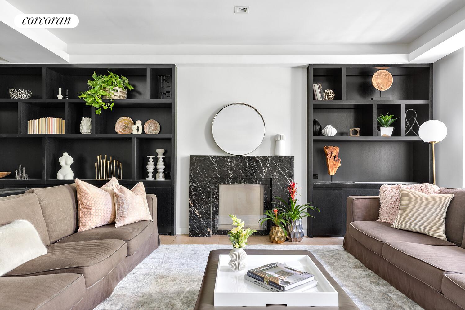 110 East 71st Street, Unit 4 Manhattan, NY 10021 - Photo 1 of 22 a living room with furniture and a fireplace