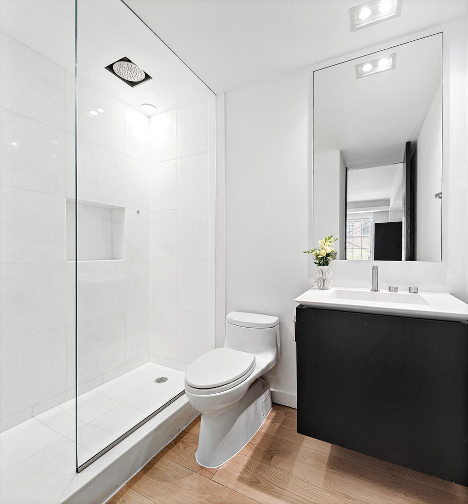 110 East 71st Street, Unit 4 Manhattan, NY 10021 - Photo 20 of 22 a bathroom with a sink toilet and shower