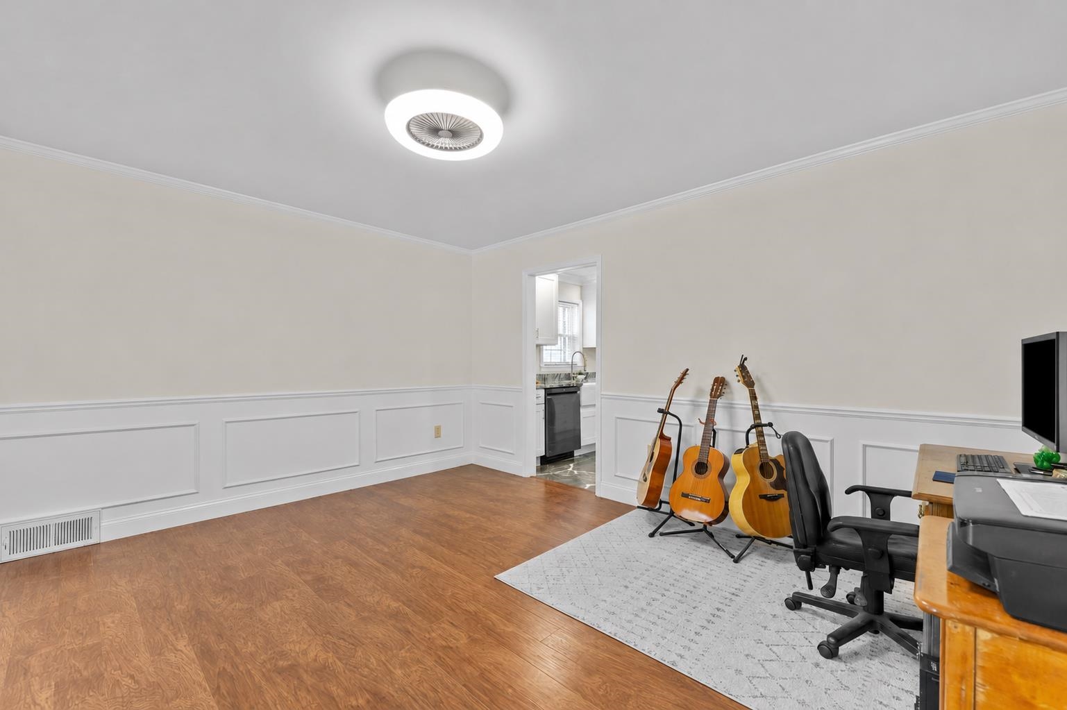 2218 Riverdale Road Germantown, TN 38138 - Photo 12 of 40 Spacious formal dining room featuring decorative wainscoting, crown molding, and flexible space for hosting holiday meals, dinner parties, and special gatherings.