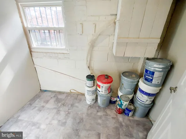 a bathroom with a sink toilet and window