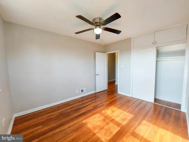 a view of room with window and ceiling fan