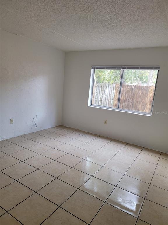 1216 Kennedy Road, Unit 11 Daytona Beach, FL 32117 - Photo 14 of 14 an empty room with windows