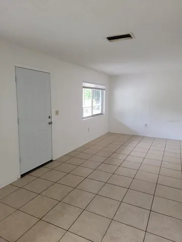 a view of an empty room and window