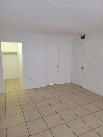 a view of an empty room and window