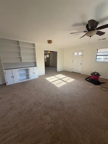a view of empty room with windows