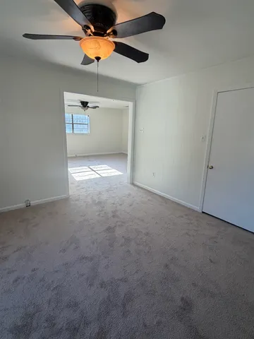 a kitchen with a sink cabinets and window