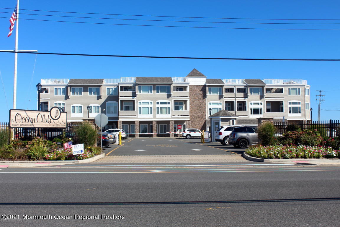 a view of a building and car parked