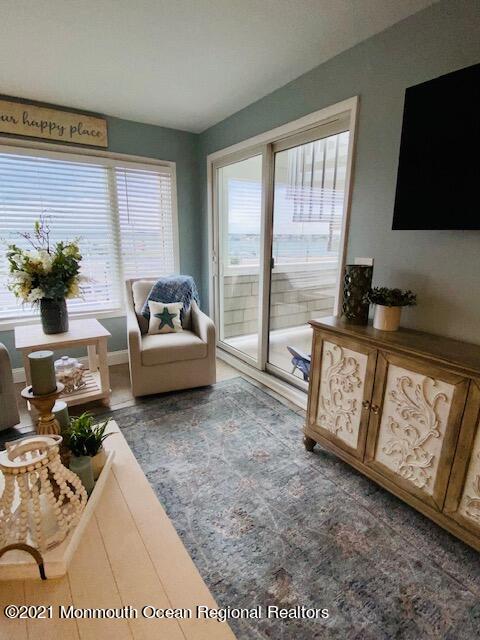 438 Highway 35, Unit 5305 Mantoloking, NJ 08738 - Photo 12 of 40 a living room with furniture and a flat screen tv