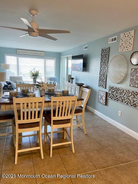 438 Highway 35, Unit 5305 Mantoloking, NJ 08738 - Photo 14 of 40 a dining room with furniture and wooden floor