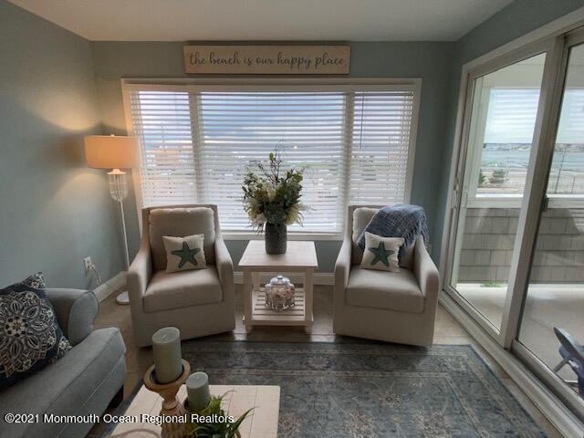 438 Highway 35, Unit 5305 Mantoloking, NJ 08738 - Photo 15 of 40 a living room with furniture and a large window