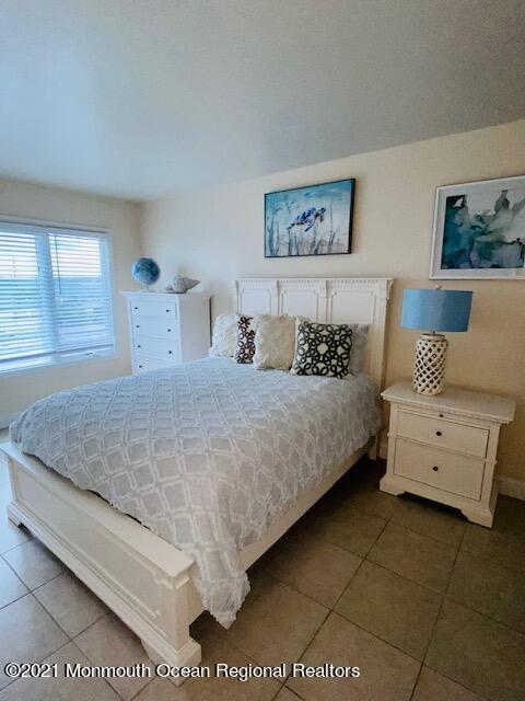 438 Highway 35, Unit 5305 Mantoloking, NJ 08738 - Photo 24 of 40 a bedroom with a bed and a couch