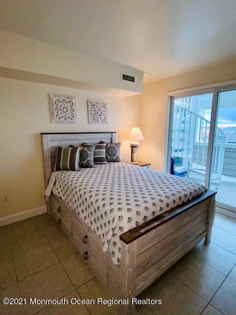 438 Highway 35, Unit 5305 Mantoloking, NJ 08738 - Photo 26 of 40 a bedroom with a bed and window