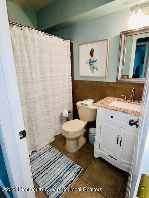 438 Highway 35, Unit 5305 Mantoloking, NJ 08738 - Photo 28 of 40 a bathroom with a sink and a mirror