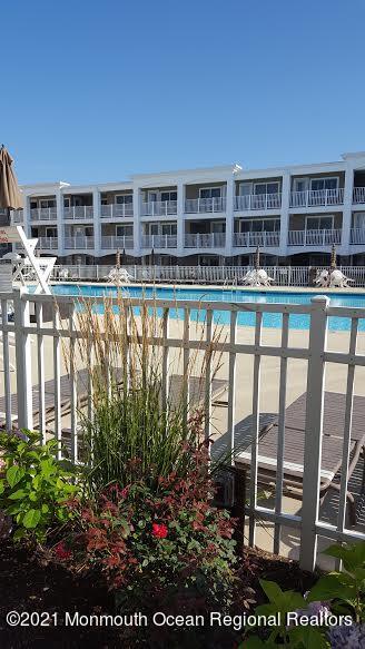 438 Highway 35, Unit 5305 Mantoloking, NJ 08738 - Photo 36 of 40 a view of a chairs and table in a balcony
