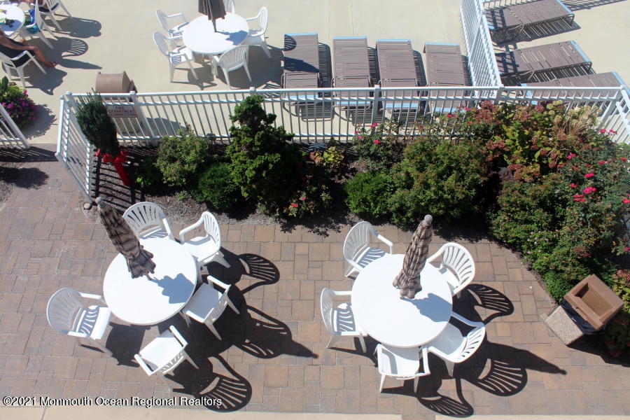 438 Highway 35, Unit 5305 Mantoloking, NJ 08738 - Photo 39 of 40 a view of a chairs and table in patio