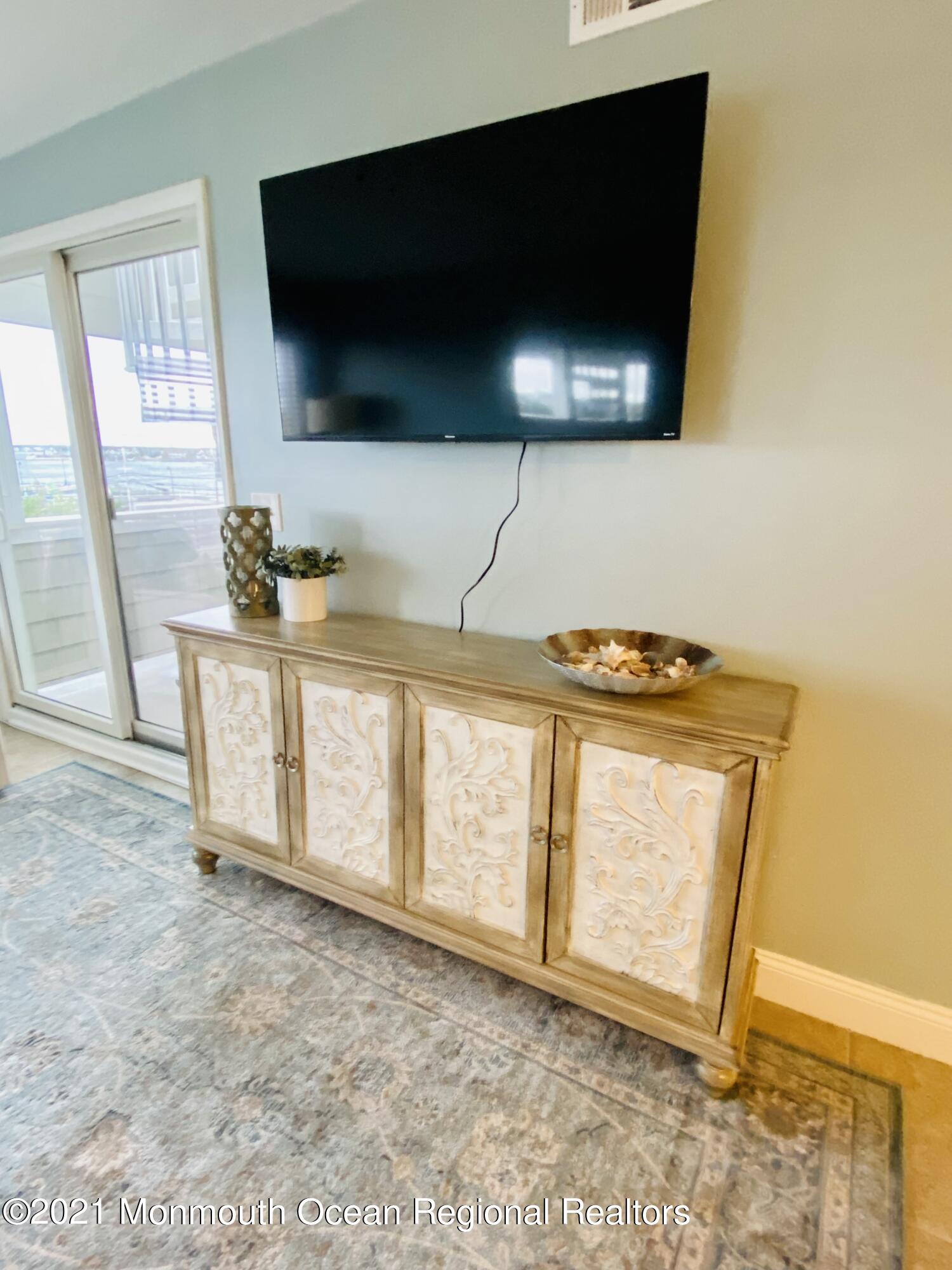 438 Highway 35, Unit 5305 Mantoloking, NJ 08738 - Photo 10 of 40 a view of washer and flat screen tv