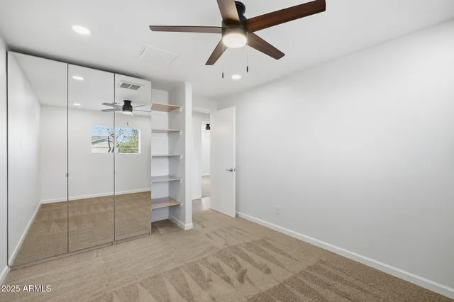 a utility room with cabinets washer and dryer