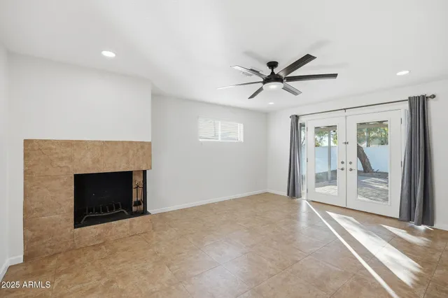 a kitchen with stainless steel appliances granite countertop a sink a stove and a refrigerator